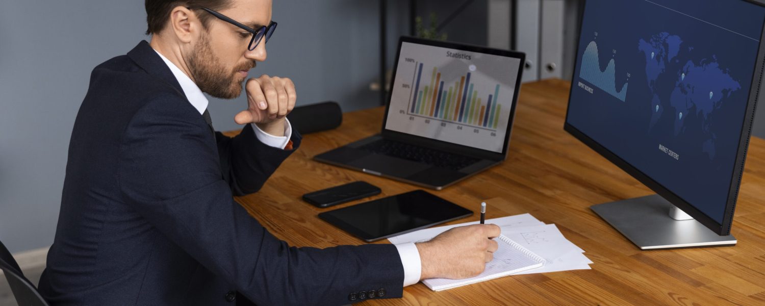 person-looking-finance-graphs